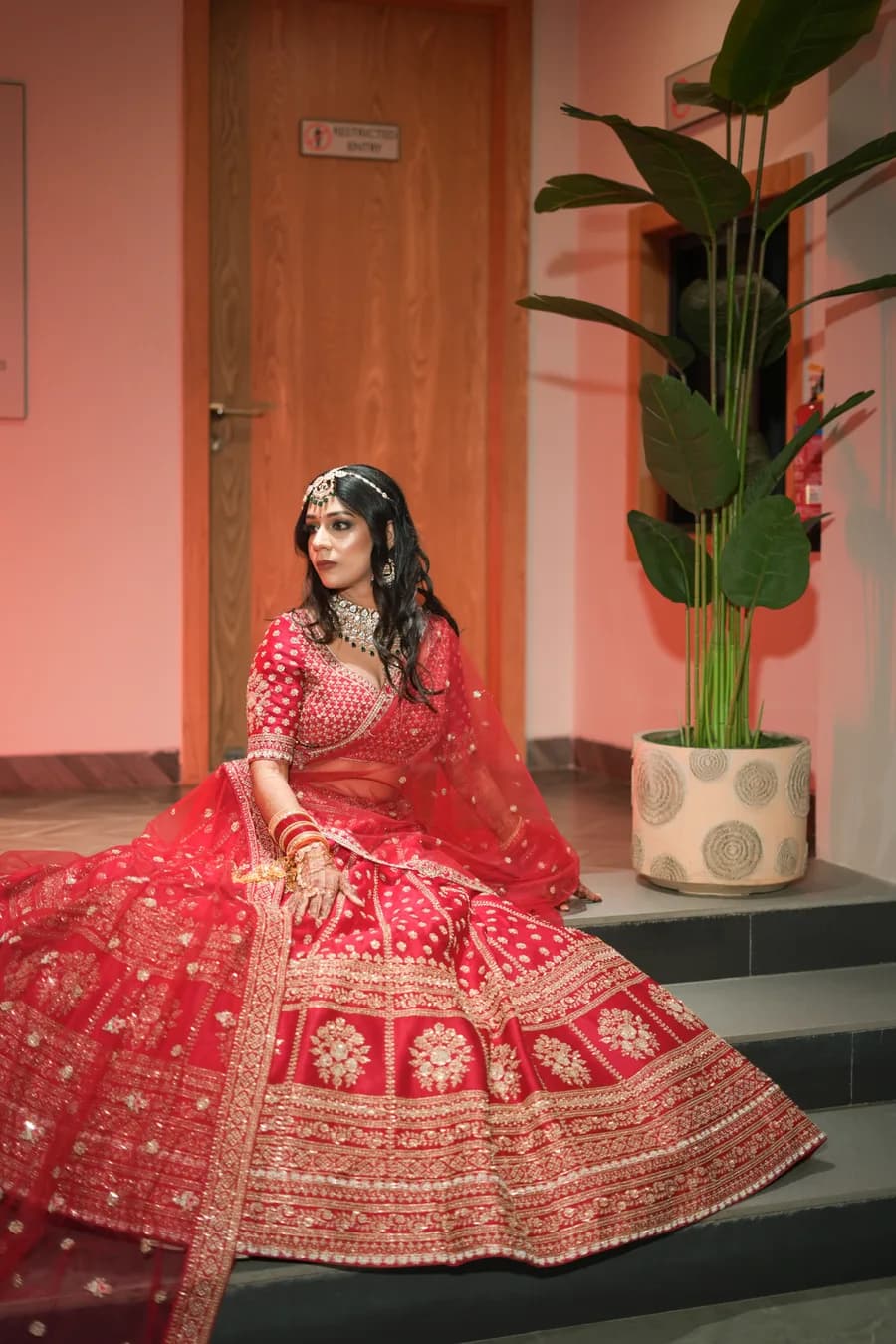 Muslim bride and groom in formal wedding attire during Nikah ceremony